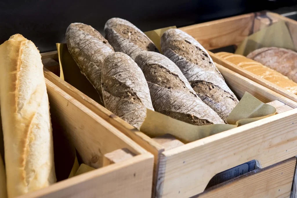 In the image some loaves of fresh bread