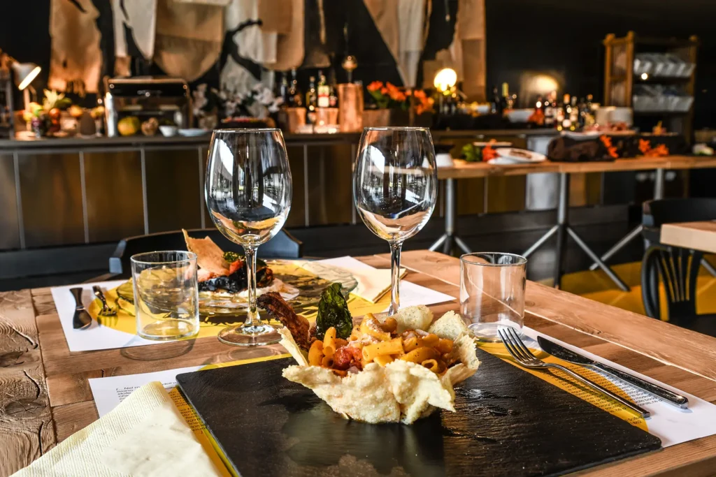 Pictured is a set table and two serving dishes